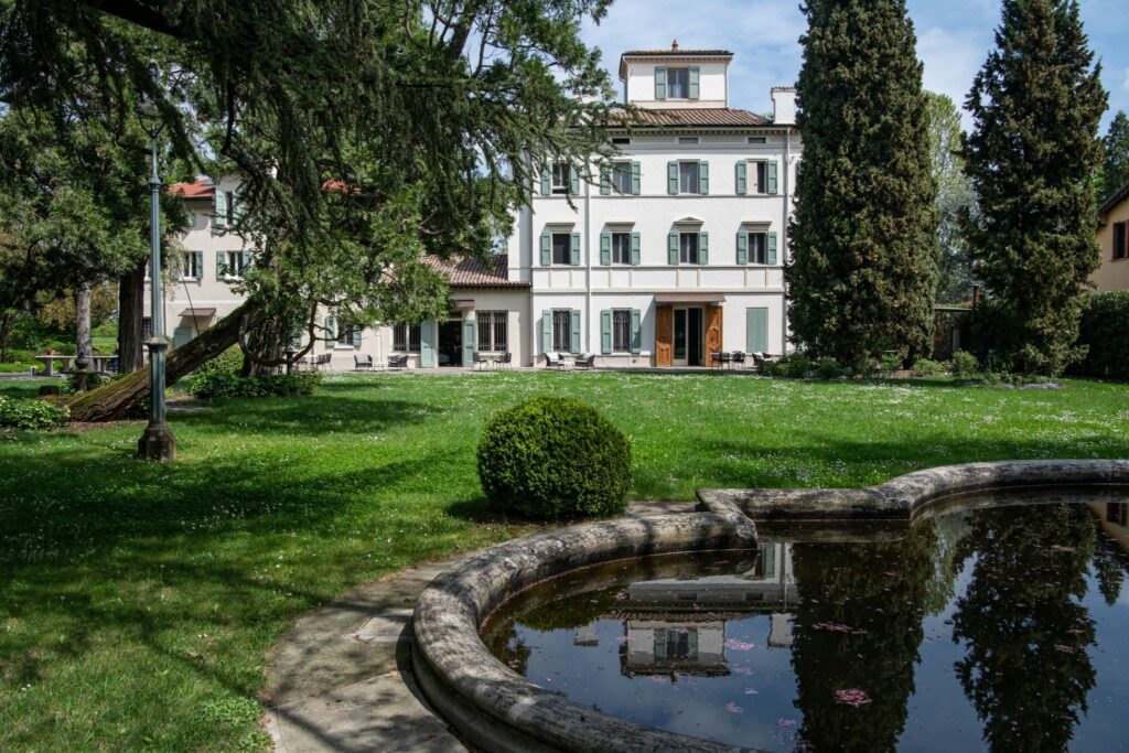 Top female chef in Italy Jessica Rosval's bed and breakfast restaurant Casa Maria Luigia. A quaint, three storey white building in Modena, Italy.