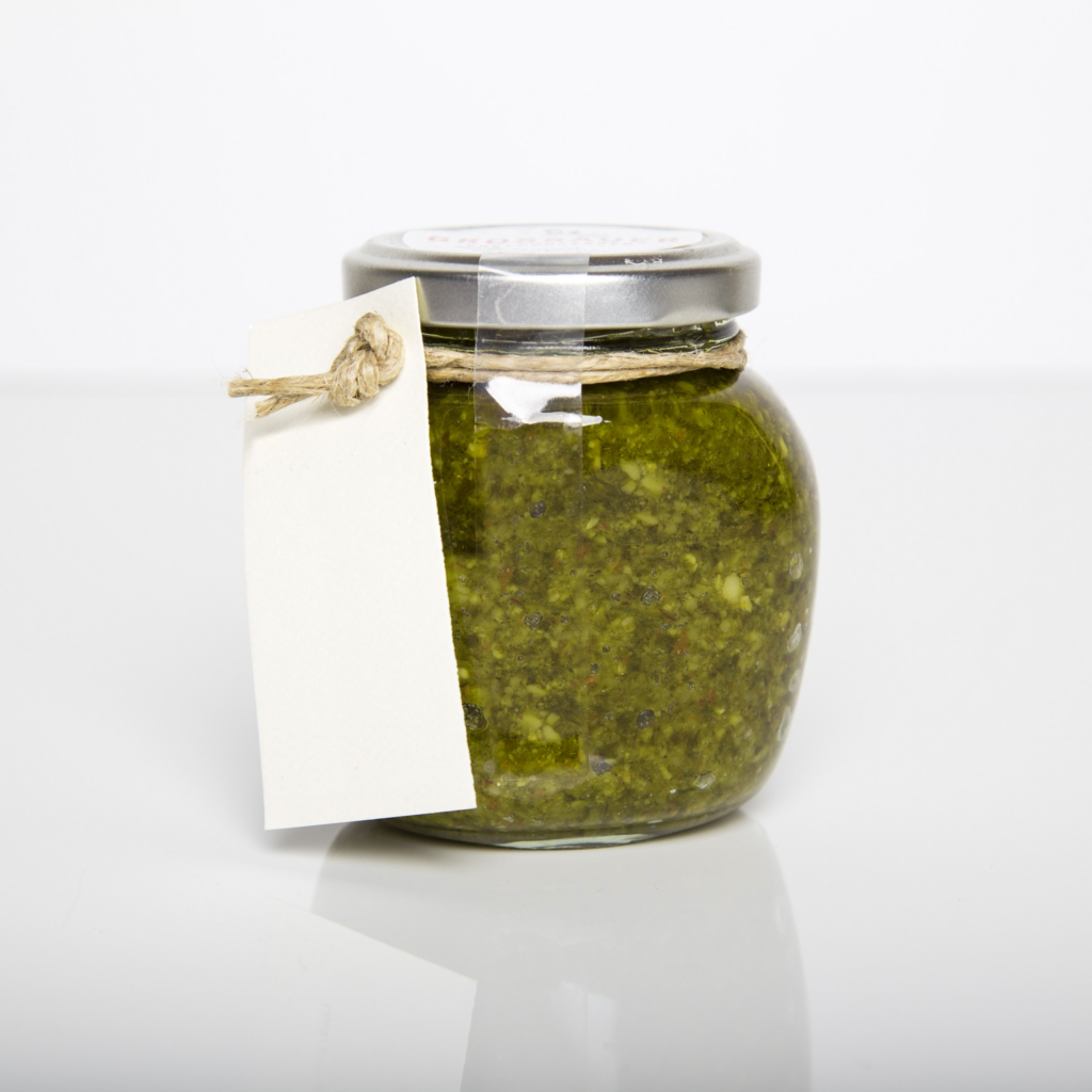 In this feature image is a jar of pesto. This is a canning example from the piece.